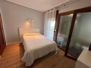 Кровать или кровати в номере Hostal El Carro