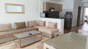 a living room with a couch and a table at Imsouane Magic House in Imsouane