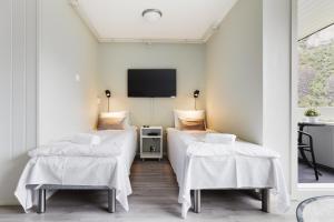 Postel nebo postele na pokoji v ubytování Trolltunga Aparthotel