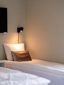 Postel nebo postele na pokoji v ubytování Trolltunga Aparthotel