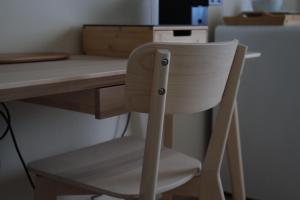 a white chair sitting in front of a desk at B&B La Casetta in Cambiago +73 photos