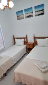 Łóżko lub łóżka w pokoju w obiekcie Marina Apartments - Valentin