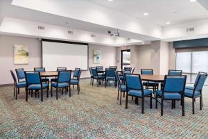 a conference room with tables and chairs and a whiteboard at Hampton Inn Madison, OH in Madison +37 photos