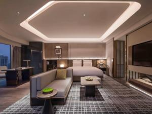 Voodi või voodid majutusasutuse Pullman Quanzhou Shuitou toas