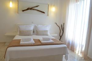 Postel nebo postele na pokoji v ubytování Niki Rooms