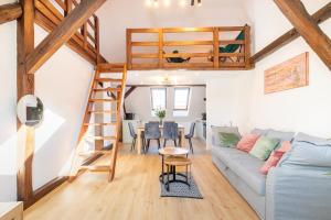 a living room with a couch and a loft bed at Apartment with Entresol Old Town Krakow in Krakow