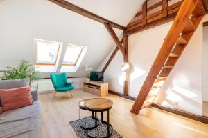 a living room with a couch and a table at Apartment with Entresol Old Town Krakow in Krakow