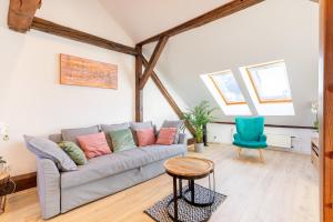 a living room with a couch and a table at Apartment with Entresol Old Town Krakow in Krakow