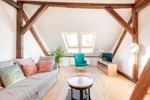 a living room with a couch and a table at Apartment with Entresol Old Town Krakow in Krakow