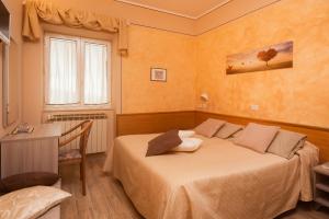 Postel nebo postele na pokoji v ubytování Albergo Ristorante il Fungo