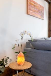 a vase sitting on a table in a living room at Apartment with Entresol Old Town Krakow in Krakow