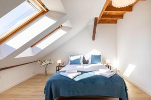 a bedroom with a bed in a attic at Apartment with Entresol Old Town Krakow in Krakow