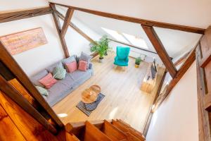 an overhead view of a living room with a couch at Apartment with Entresol Old Town Krakow in Krakow