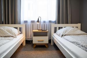 Posteľ alebo postele v izbe v ubytovaní Moon Hostel Wrocław