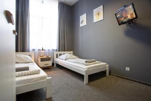 Posteľ alebo postele v izbe v ubytovaní Moon Hostel Wrocław