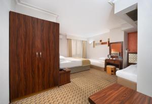 Postel nebo postele na pokoji v ubytování Elan Hotel Istanbul Pera
