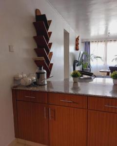 Een keuken of kitchenette bij Honey Dew Greatwall Apartments