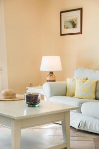 a living room with a couch and a coffee table at Villa Petri in Trapezaki