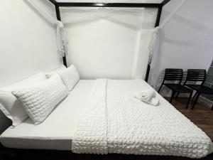 Postel nebo postele na pokoji v ubytování Mahajab Homestay SIARGAO