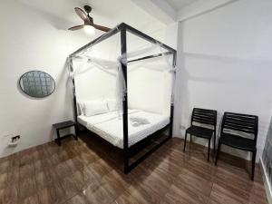 Postel nebo postele na pokoji v ubytování Mahajab Homestay SIARGAO