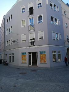 a large white building on a city street at Appartement Donauwelle 2 in Passau