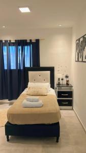 En eller flere senge i et værelse på Casa Naranja habitaciones privadas