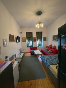 TV o dispositivi per l'intrattenimento presso Guesthouse Hurma Rooms