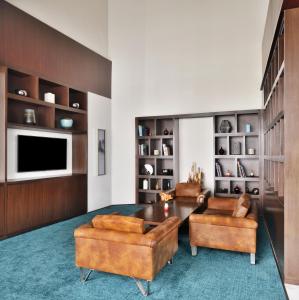 a living room with two chairs and a table at The Westin Kolkata Rajarhat in Kolkata