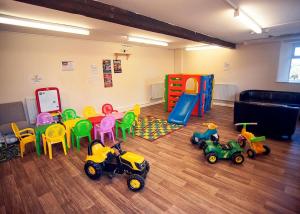 a room with a bunch of toys on the floor at Meadow Lakes Holiday Park in St Austell