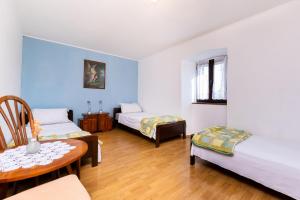 Giường trong phòng chung tại Apartment Petar