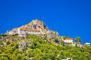 a house on the side of a mountain at Apartment Oliva in Knin