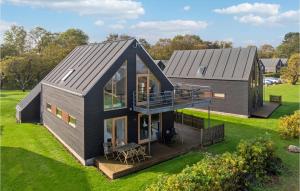 an aerial view of a house with a deck at Gorgeous Home In Stubbekbing With Kitchen in Stubbekøbing