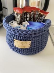 a blue crochet basket sitting on a counter at Patie's Hill in Penicuik