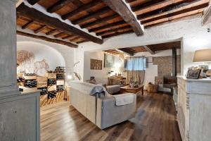 a living room with a couch and a table at Casa Collicello relax in Camaiore