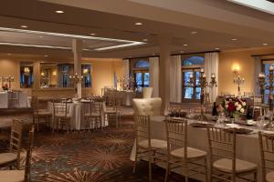 a banquet room with tables and chairs in a hotel at Kona Kai Resort & Spa, a Noble House Resort in San Diego