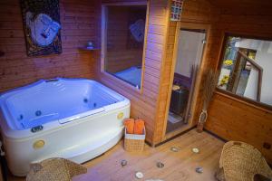 a bathroom with a large tub in a house at VILLA KYRA LUXURY in Sinaia +43 photos