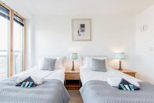 Łóżko lub łóżka w pokoju w obiekcie Premium Apartments By Excel
