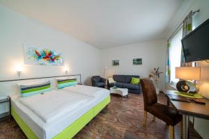 Postel nebo postele na pokoji v ubytování Hotel Stadtkrug + 37 fotografií