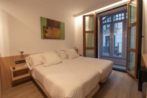 Postel nebo postele na pokoji v ubytování Hotel Cortabitarte