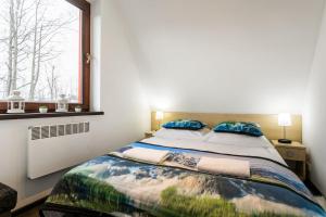 Posteľ alebo postele v izbe v ubytovaní Apartament w malowniczej Dolinie Kościeliskiej by Rent like home
