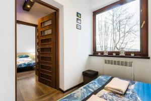 Posteľ alebo postele v izbe v ubytovaní Apartament w malowniczej Dolinie Kościeliskiej by Rent like home