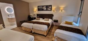 Postel nebo postele na pokoji v ubytování Hotel le Bellevue