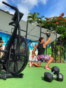 a man in a gym with a cage at Résidence Paradis Tropical in Basse-Terre