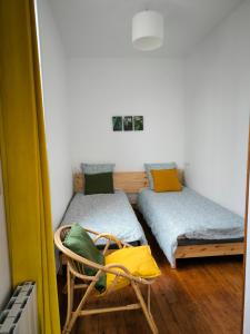 En eller flere senger på et rom på La Vigorienne