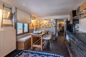 a kitchen and dining room with a table in a caravan at Dandy Villas Metsovo-Mezzo-Down Town-Up 5 in Metsovo