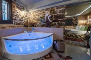 a bathroom with a large tub in the middle at Dandy Villas Metsovo in Metsovo