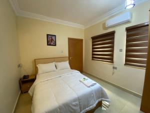 Letto o letti in una camera di MOK Apartments & Suites