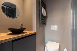a bathroom with a sink and a toilet at Dify Balcony - Quartier Ainay in Lyon