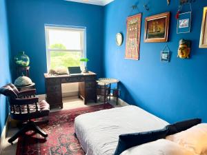 En eller flere senge i et værelse på Skyline Oasis