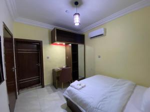 Letto o letti in una camera di MOK Apartments & Suites